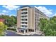 Spacious brick apartment building featuring multiple balconies with lush tree surround at 3965 N Meridian St # 3J West, Indianapolis, IN 46208