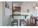Kitchen with breakfast bar and dining area at 3965 N Meridian St # 3J West, Indianapolis, IN 46208