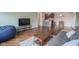 Living room with hardwood floors, dining area, and open kitchen at 3965 N Meridian St # 3J West, Indianapolis, IN 46208