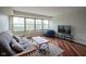 Living room with hardwood floors, a futon, and a view from the window at 3965 N Meridian St # 3J West, Indianapolis, IN 46208