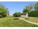 Spacious backyard features a charming shed, well-maintained lawn, and beautiful landscaping, perfect for outdoor activities at 4195 Locust Ln, Brownsburg, IN 46112
