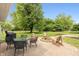 Serene backyard with a brick patio, fire pit, and outdoor furniture, perfect for enjoying the outdoors at 4195 Locust Ln, Brownsburg, IN 46112