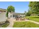 A fire pit and outdoor furniture sit in a lovely backyard, ideal for relaxing and entertaining guests at 4195 Locust Ln, Brownsburg, IN 46112