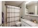 Bathroom featuring a shower-tub combo, vanity with sink, and neutral decor at 4195 Locust Ln, Brownsburg, IN 46112