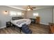 Cozy bedroom with a ceiling fan, natural light, and wood-look flooring at 4195 Locust Ln, Brownsburg, IN 46112
