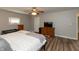 Comfortable bedroom with hardwood floors, ceiling fan and windows that bring in natural light at 4195 Locust Ln, Brownsburg, IN 46112