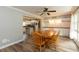 Open-concept dining area with modern lighting fixtures and view to the kitchen, perfect for entertaining at 4195 Locust Ln, Brownsburg, IN 46112