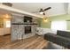 Cozy living room features a brick fireplace, modern ceiling fan, and comfortable seating at 4195 Locust Ln, Brownsburg, IN 46112