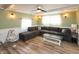 Comfortable living room offers a large sectional sofa, modern decor, and ample natural light at 4195 Locust Ln, Brownsburg, IN 46112