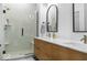 Modern bathroom featuring double sinks, a tiled shower, and sleek fixtures at 420 Monon Wy Dr, Carmel, IN 46032