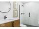 The bathroom includes a walk-in shower with black hardware and a modern wood vanity at 420 Monon Wy Dr, Carmel, IN 46032