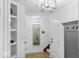 The entryway features modern lighting and a decorative wall at 420 Monon Wy Dr, Carmel, IN 46032
