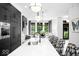 Bright, modern kitchen with white countertop, black cabinets, and pendant lighting at 420 Monon Wy Dr, Carmel, IN 46032