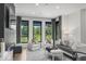 Well-lit living room with large windows offering picturesque views of the outdoors at 420 Monon Wy Dr, Carmel, IN 46032