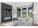This living room is well-lit with a modern fireplace at 420 Monon Wy Dr, Carmel, IN 46032