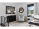 This office space has a large window, a faux fur chair and creative decor at 420 Monon Wy Dr, Carmel, IN 46032