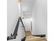 This staircase features black metal railings and wood stairs with decorative carpet at 420 Monon Wy Dr, Carmel, IN 46032