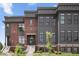 Modern townhouse with brick and composite siding, front door and steps at 420 Monon Wy Dr, Carmel, IN 46032