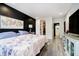 Bright bedroom with hard floors and a walk-in closet and an ensuite bathroom at 430 N Park Ave # 211, Indianapolis, IN 46202
