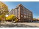 Beautiful brick building with large windows and street view on a sunny day at 430 N Park Ave # 211, Indianapolis, IN 46202