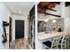Charming kitchen with chalkboard wall, granite counters, stainless appliances, and pendant lighting at 430 N Park Ave # 211, Indianapolis, IN 46202