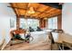 Expansive living room with wood floors, exposed beams, and ample natural light at 430 N Park Ave # 211, Indianapolis, IN 46202