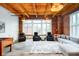 Comfortable living room with wood ceiling, exposed brick, and cozy seating at 430 N Park Ave # 211, Indianapolis, IN 46202