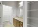 Bathroom with a sink, a mirror, and shelving at 450 E Ohio St # Apt 305, Indianapolis, IN 46204