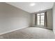 Bedroom with carpet flooring, window, and neutral paint at 450 E Ohio St # Apt 305, Indianapolis, IN 46204