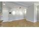 Bright and open living area with hardwood floors, neutral walls, and recessed lighting at 450 E Ohio St # Apt 305, Indianapolis, IN 46204