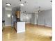 Bright living room with hardwood floors, ceiling fan, and open floor plan to kitchen with breakfast bar at 450 E Ohio St # Apt 305, Indianapolis, IN 46204