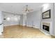 Bright living room with hardwood floors, fireplace, and an open floor plan at 450 E Ohio St # Apt 305, Indianapolis, IN 46204