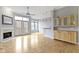 Bright living room with fireplace, hardwood floors, and french doors leading to outdoor terrace at 450 E Ohio St # Apt 305, Indianapolis, IN 46204