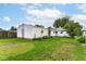 Spacious backyard with a detached garage offering ample outdoor space for recreation and relaxation at 4751 Payton Ave, Lawrence, IN 46226