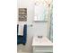 Bathroom featuring a stylish ocean themed shower curtain and a framed inspirational sign on the wall at 4751 Payton Ave, Lawrence, IN 46226