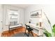 Bright bedroom features a desk, bench seat and hardwood floors at 4751 Payton Ave, Lawrence, IN 46226