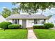 Charming single-story home featuring a well-maintained lawn and manicured shrubs at 4751 Payton Ave, Lawrence, IN 46226