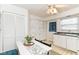 Cozy kitchen and dining area with ample cabinet space and neutral decor at 4751 Payton Ave, Lawrence, IN 46226