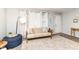 Cozy living room featuring neutral tones, a comfortable couch, and ample natural light at 4751 Payton Ave, Lawrence, IN 46226