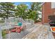 The large back deck features outdoor seating and dining spaces with multiple entry points to the backyard at 4817 N 150 W, Anderson, IN 46011