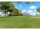 Expansive backyard view showcasing the back deck and home exterior at 4817 N 150 W, Anderson, IN 46011