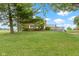 Expansive backyard view showcasing the back deck and home exterior at 4817 N 150 W, Anderson, IN 46011