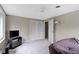 Neutral bedroom featuring carpet, a tv and media center, and large windows for great natural light at 4817 N 150 W, Anderson, IN 46011