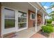 Welcoming view of the home's front porch with traditional brick facade and plantings at 4817 N 150 W, Anderson, IN 46011