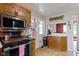 Functional kitchen with essential appliances and wood cabinets at 4817 N 150 W, Anderson, IN 46011