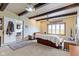 Bright living room with comfortable seating, wood-paneled walls and large window views at 4817 N 150 W, Anderson, IN 46011