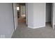Neutral bedroom showcasing carpet and an entrance to another room at 4947 Amber Crest Dr, Brownsburg, IN 46112
