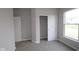 Comfortable carpeted bedroom featuring a closet and natural light at 4947 Amber Crest Dr, Brownsburg, IN 46112