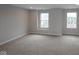 A well-lit bedroom with soft carpeting, light-colored walls, and windows that provide plenty of natural light at 4947 Amber Crest Dr, Brownsburg, IN 46112