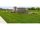 Inviting entrance to Auburn Ridge with lush landscaping and stone signage at 4947 Amber Crest Dr, Brownsburg, IN 46112
